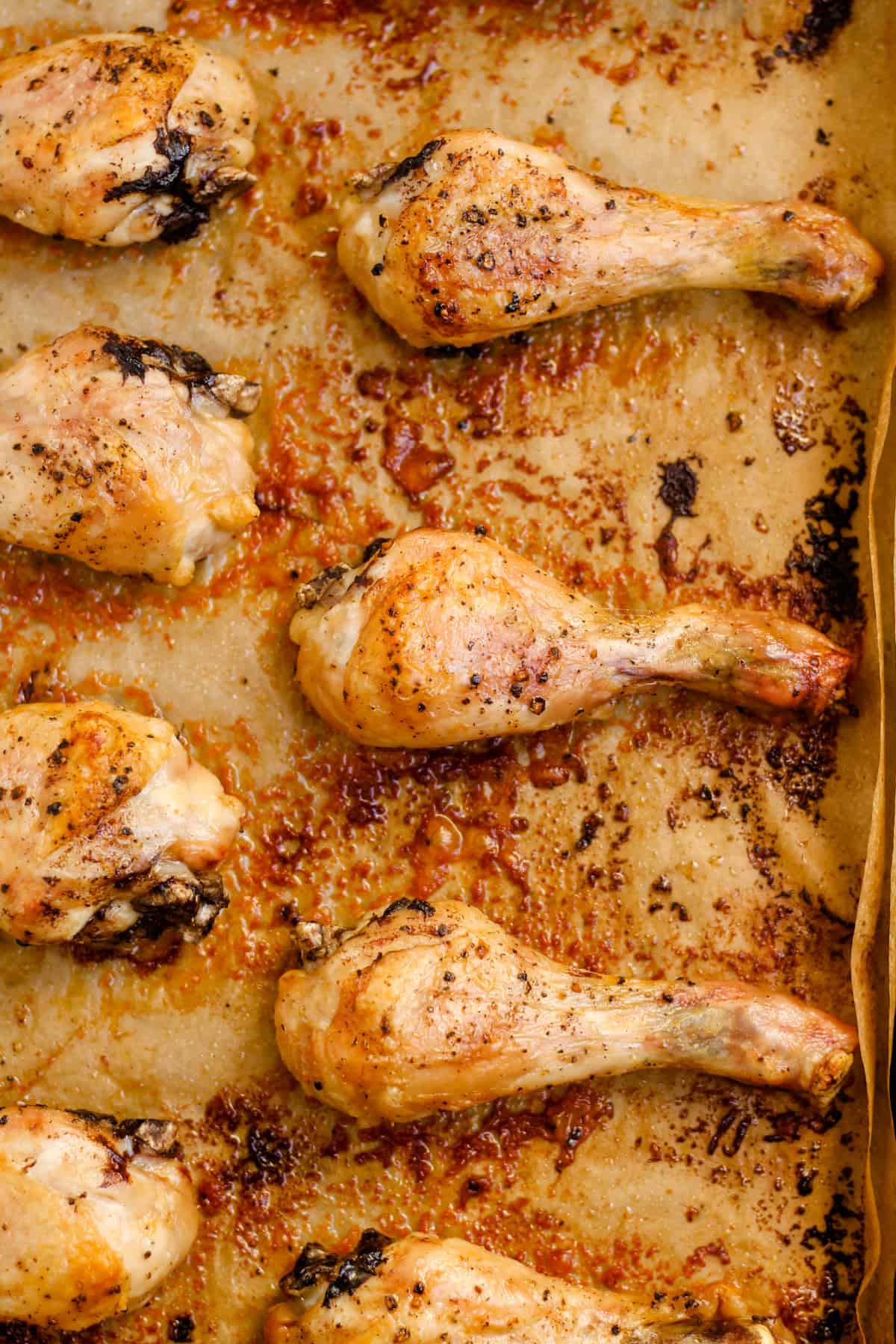 Overhead image of baked chicken drumsticks.