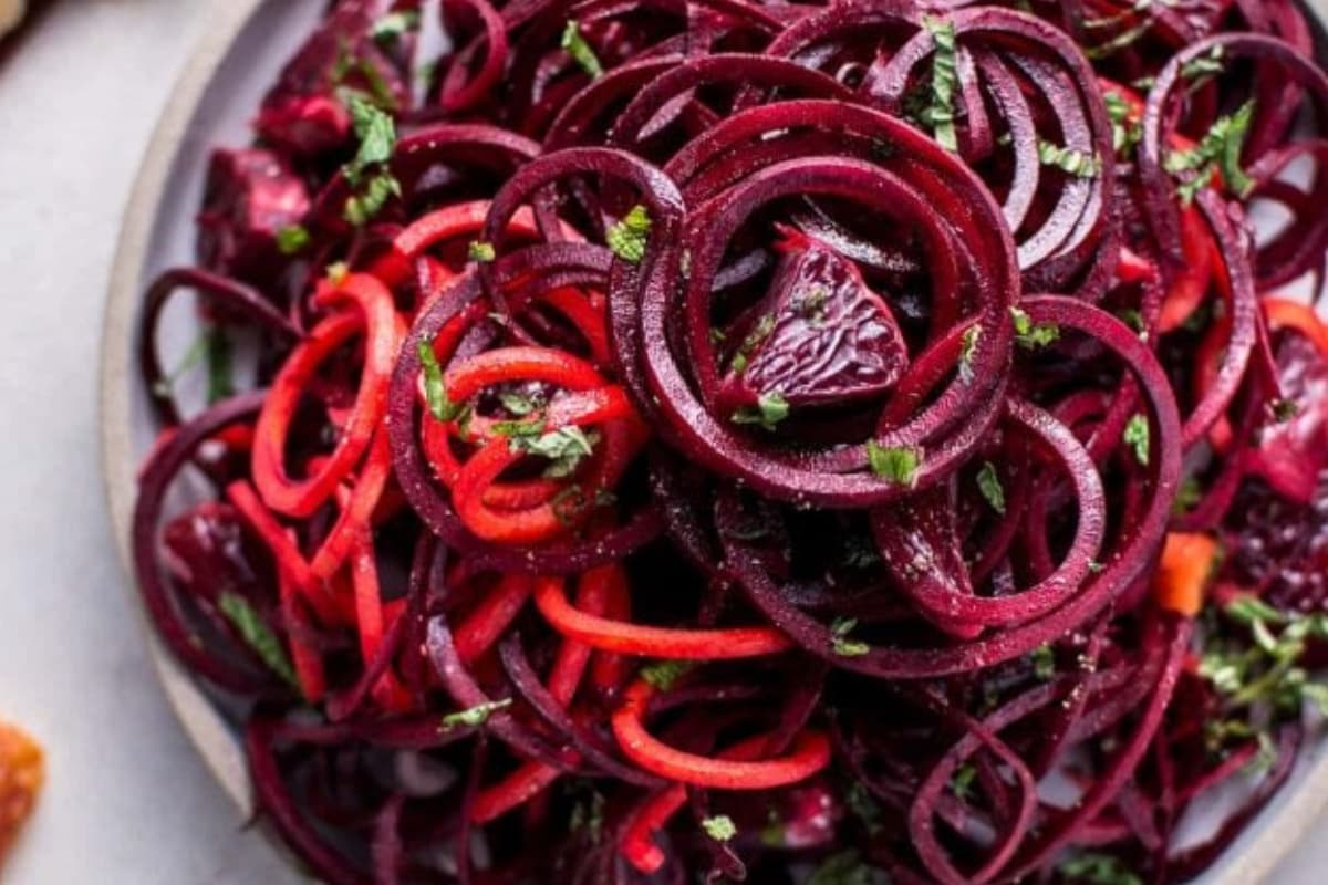 A dish of Spiralized Raw Beet Salad with Blood Oranges.