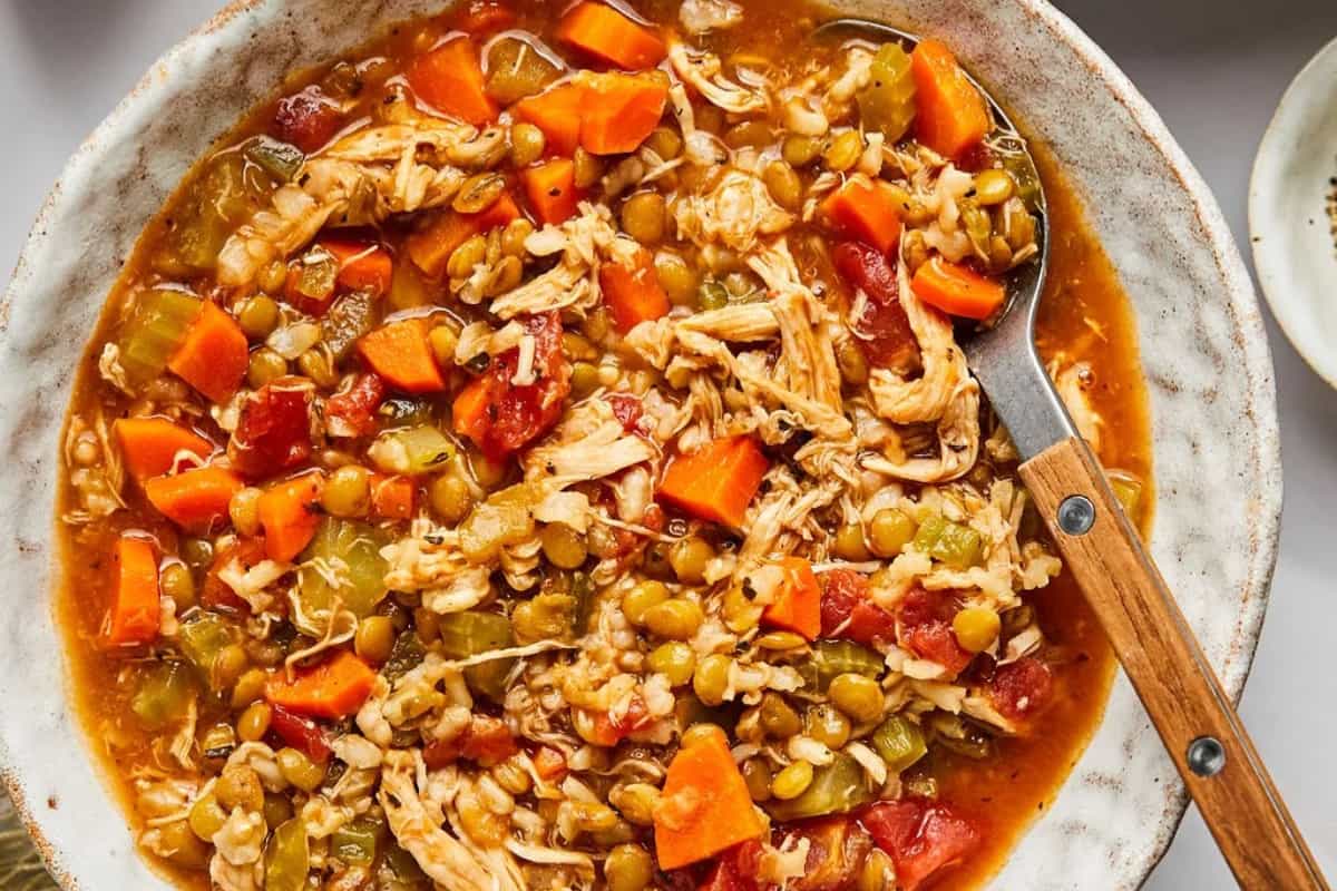 A bowl of Chicken Lentil and Rice Soup.