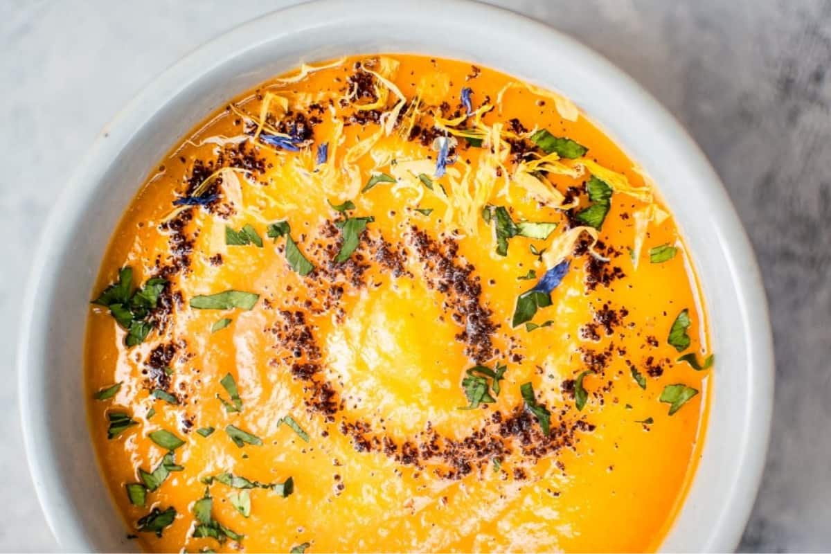 A bowl of Spicy Chipotle Sweet Potato Soup.