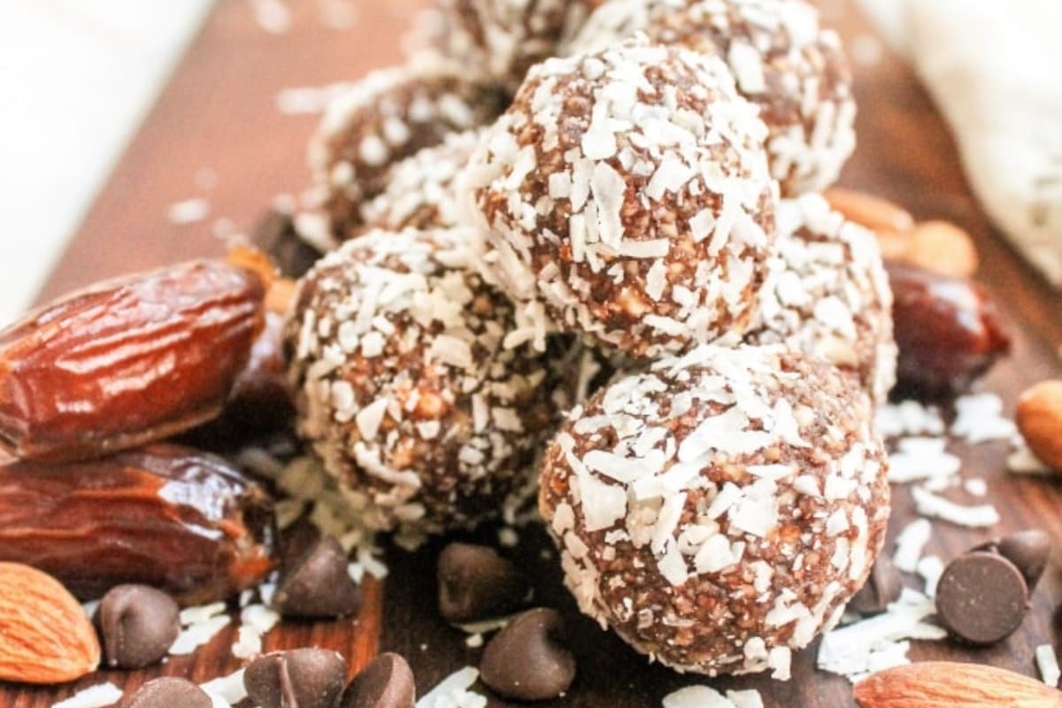 A plate of No Bake Chocolate Coconut Date Balls.