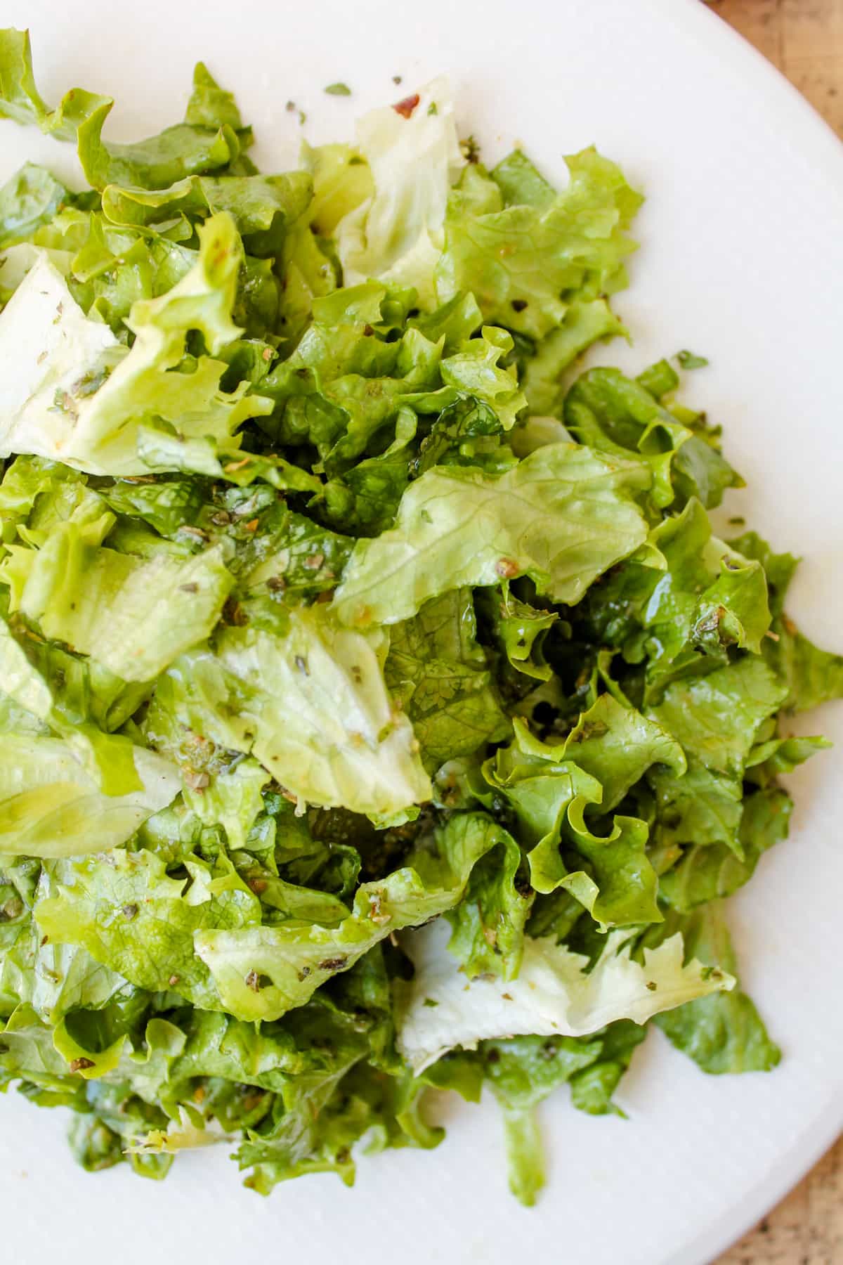Green salad coated in homemade Italian dressing.
