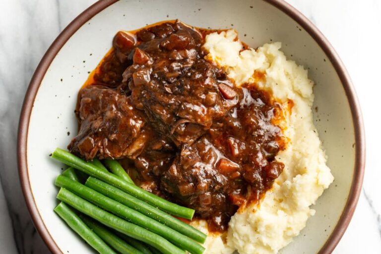 A plate of Red Wine Braised Short Ribs.