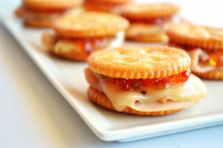 A plate of ritz cracker appetizers.