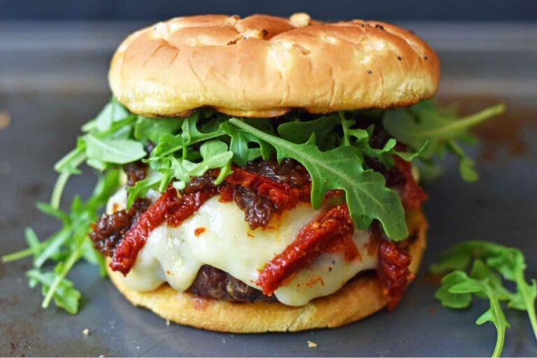 A plate of Brie Burger with Caramelized Onions.