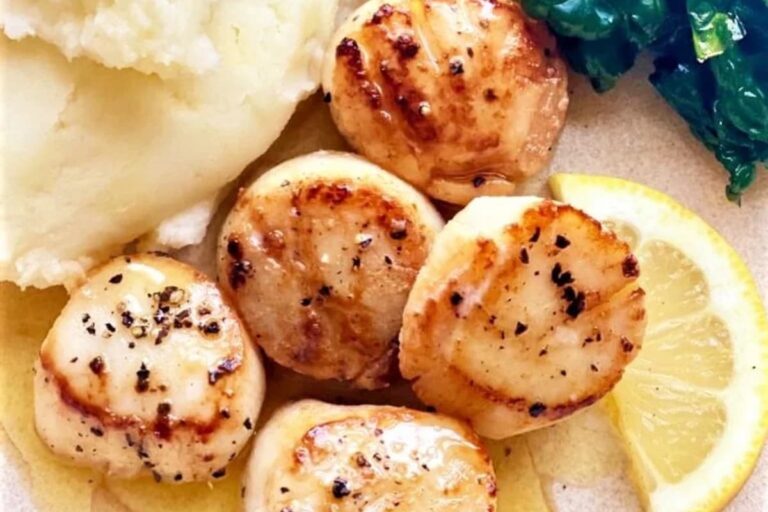 A plate of Perfectly Seared Cast Iron Scallops.