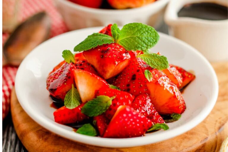 A plate of Balsamic Strawberries with Mint.