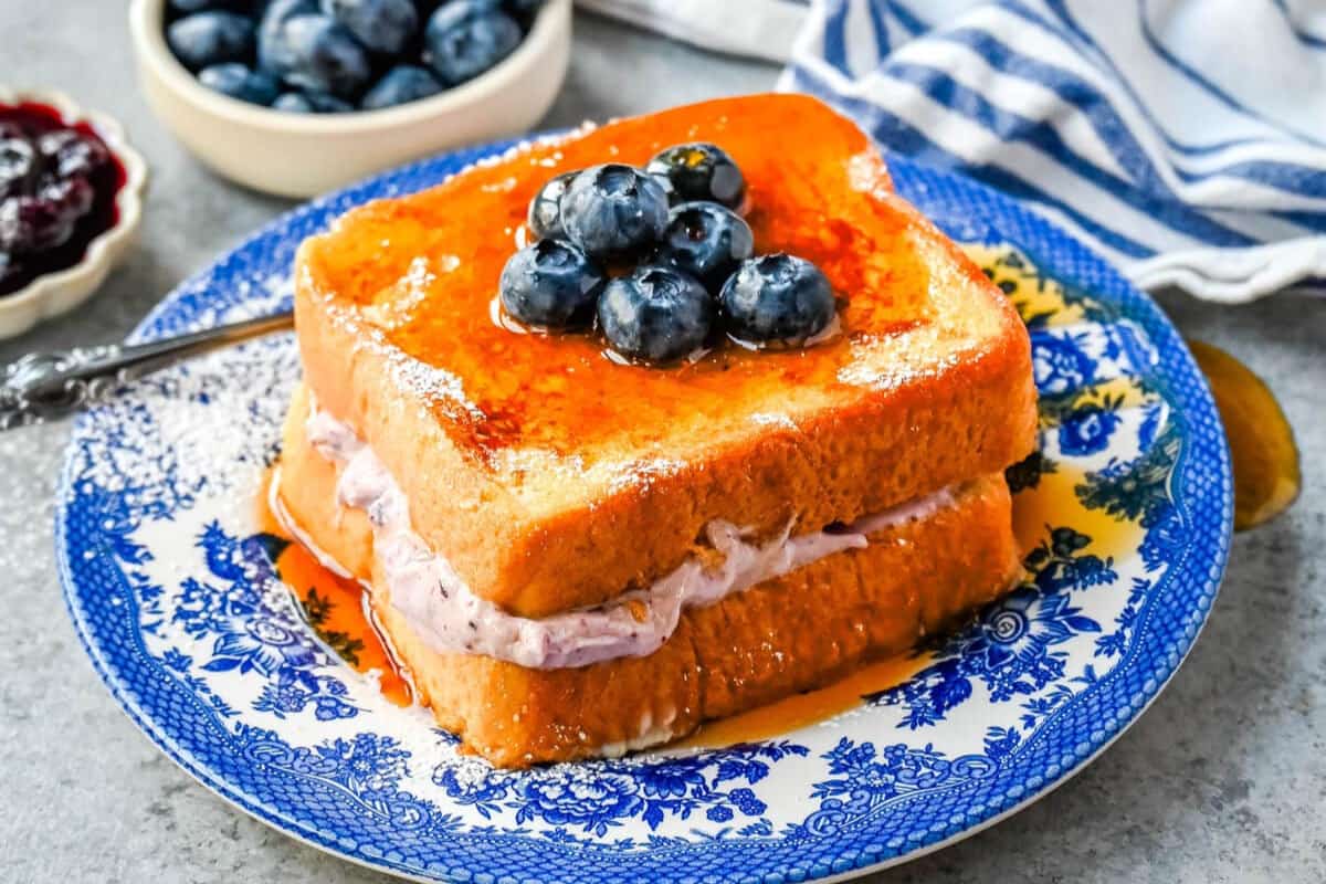 A plate of Blueberry Cheesecake Stuffed French Toast.