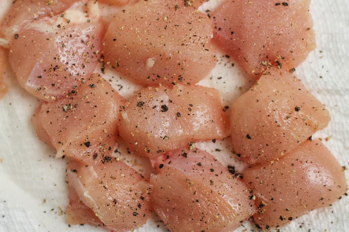 Chicken pieces on a paper towel.