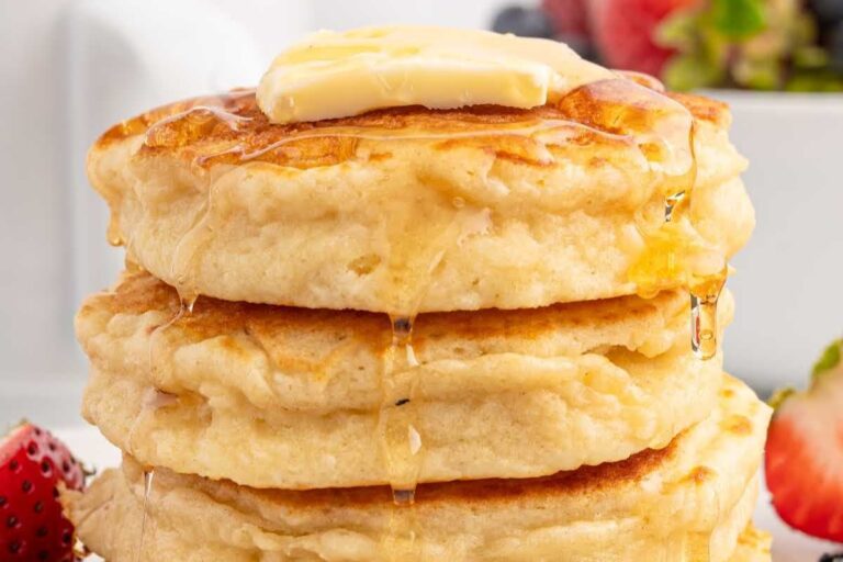 A plate of Fluffy Pancakes with Whole Milk.