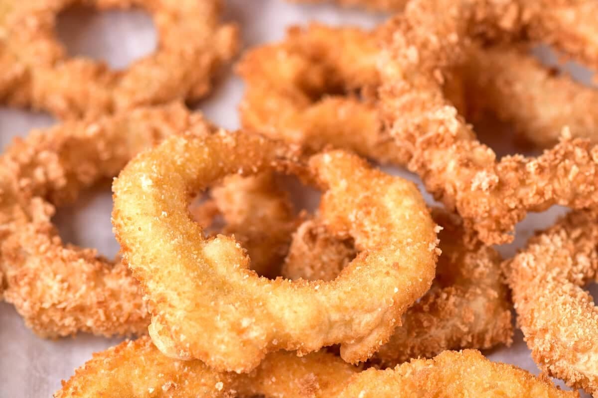 A plate of Crispy Air Fried Onion Rings.