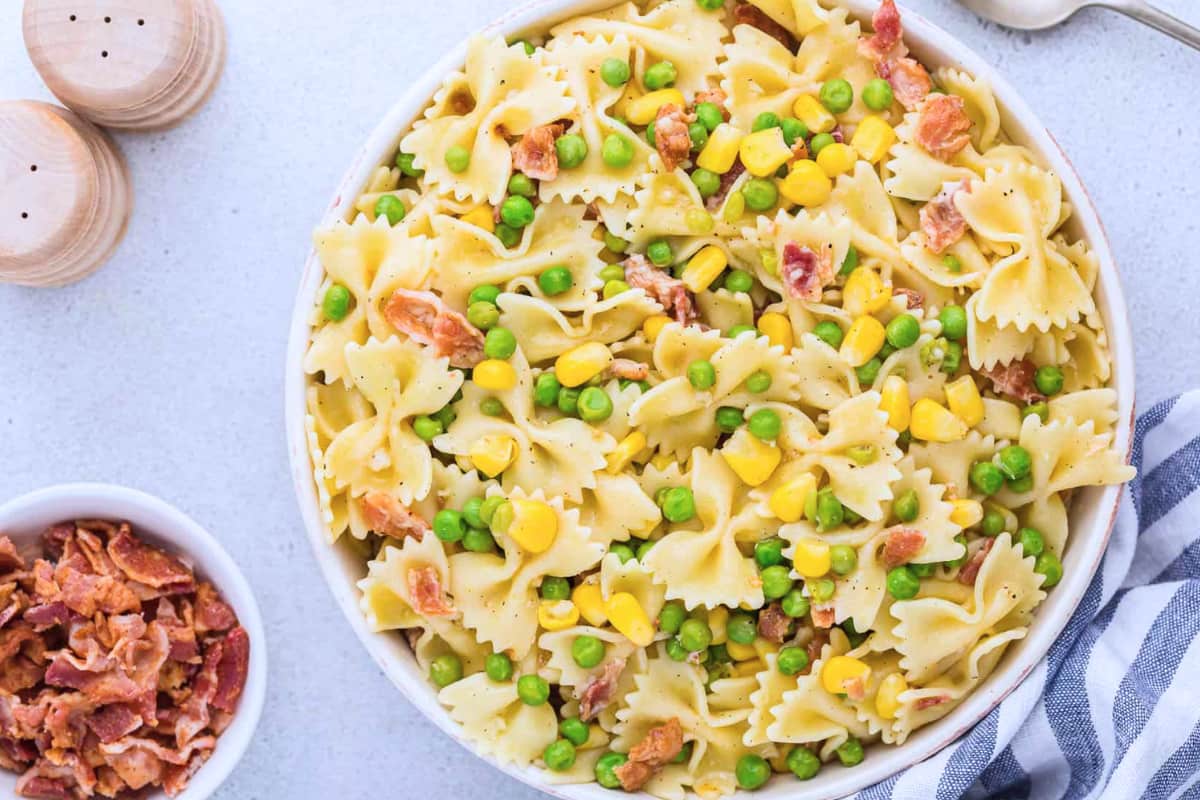 A bowl of Easy Bacon Pea Pasta Salad.
