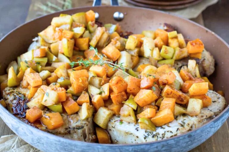 A dish of Pork Chops with Apples and Butternut Squash.
