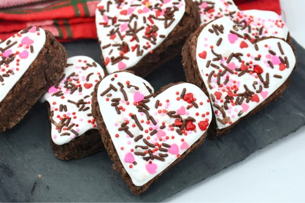 A plate of Heart Shaped Brownies with White Chocolate Frosting.