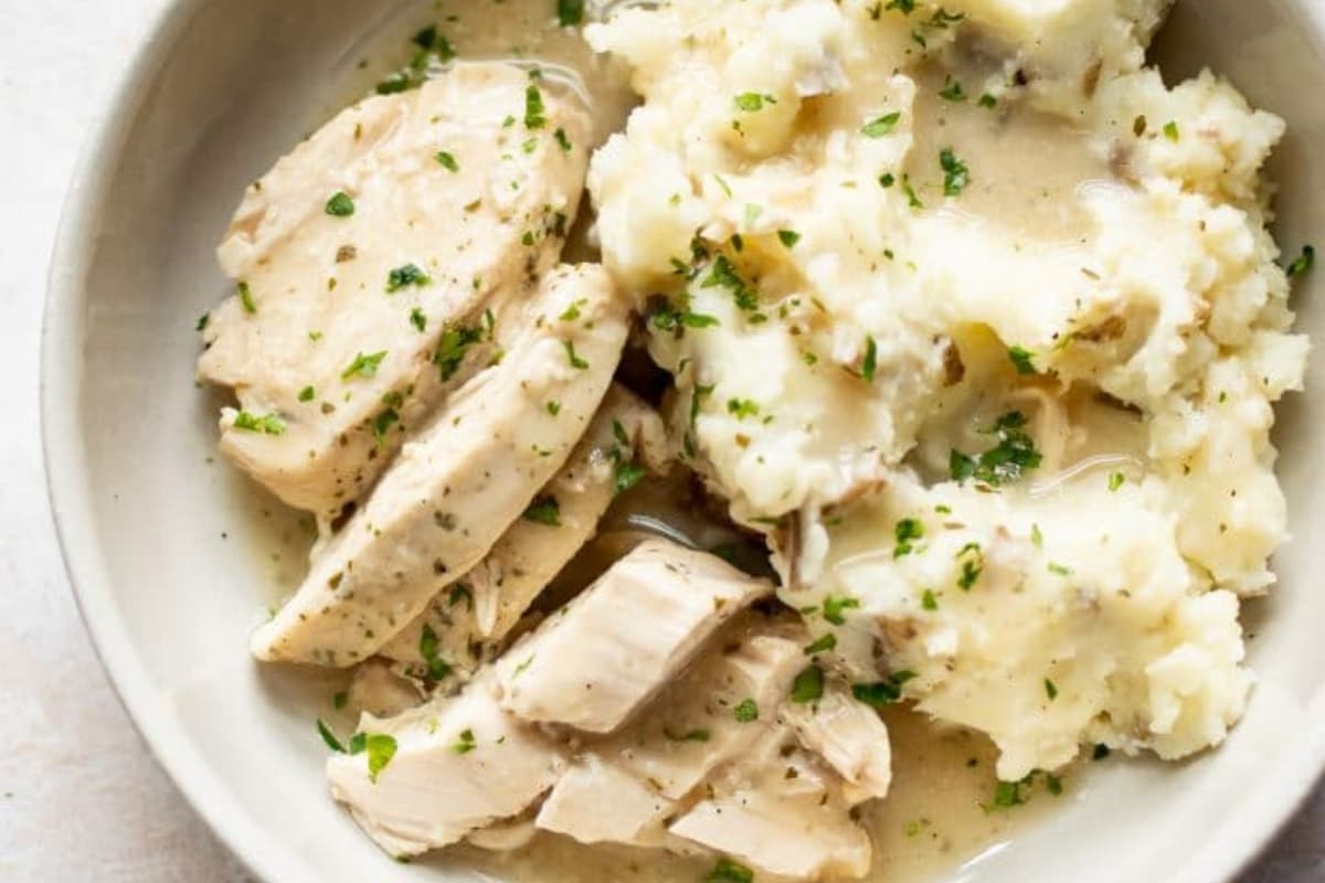 A dish of Crockpot Chicken and Gravy.