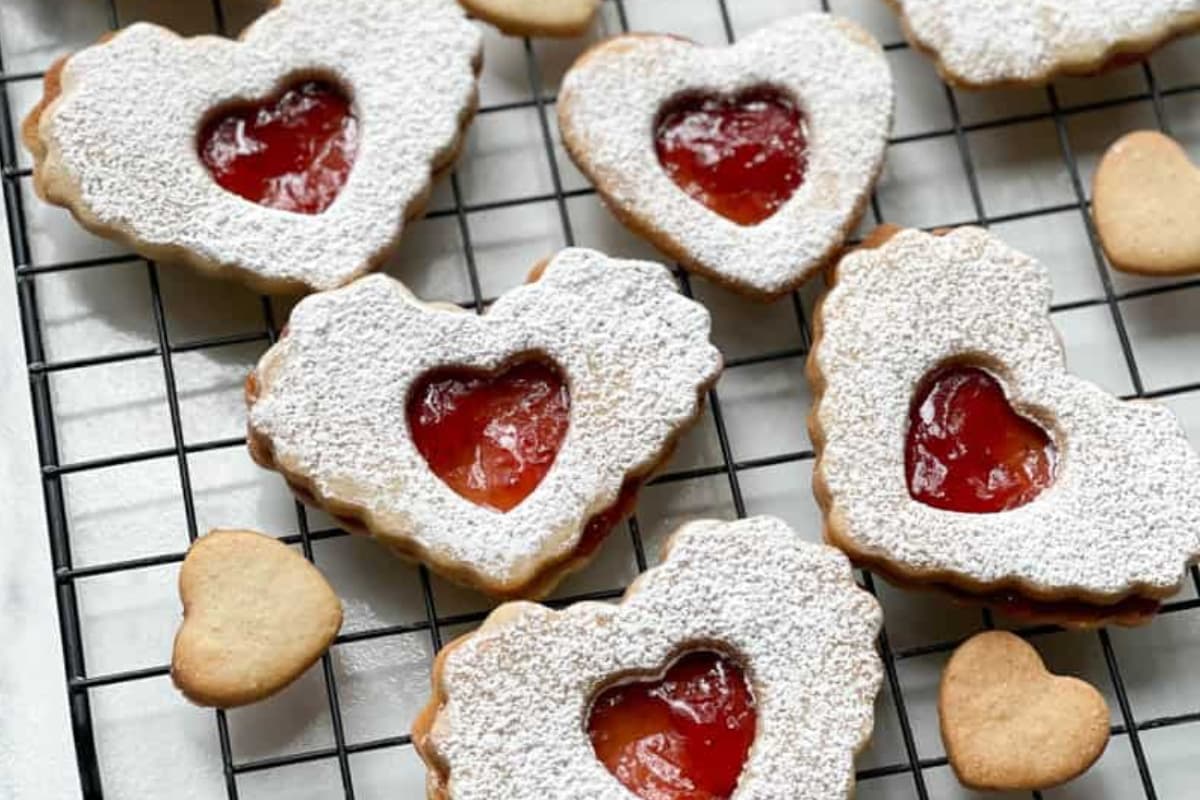 A rack of Heart-Shaped Strawberry Jam Cookies.