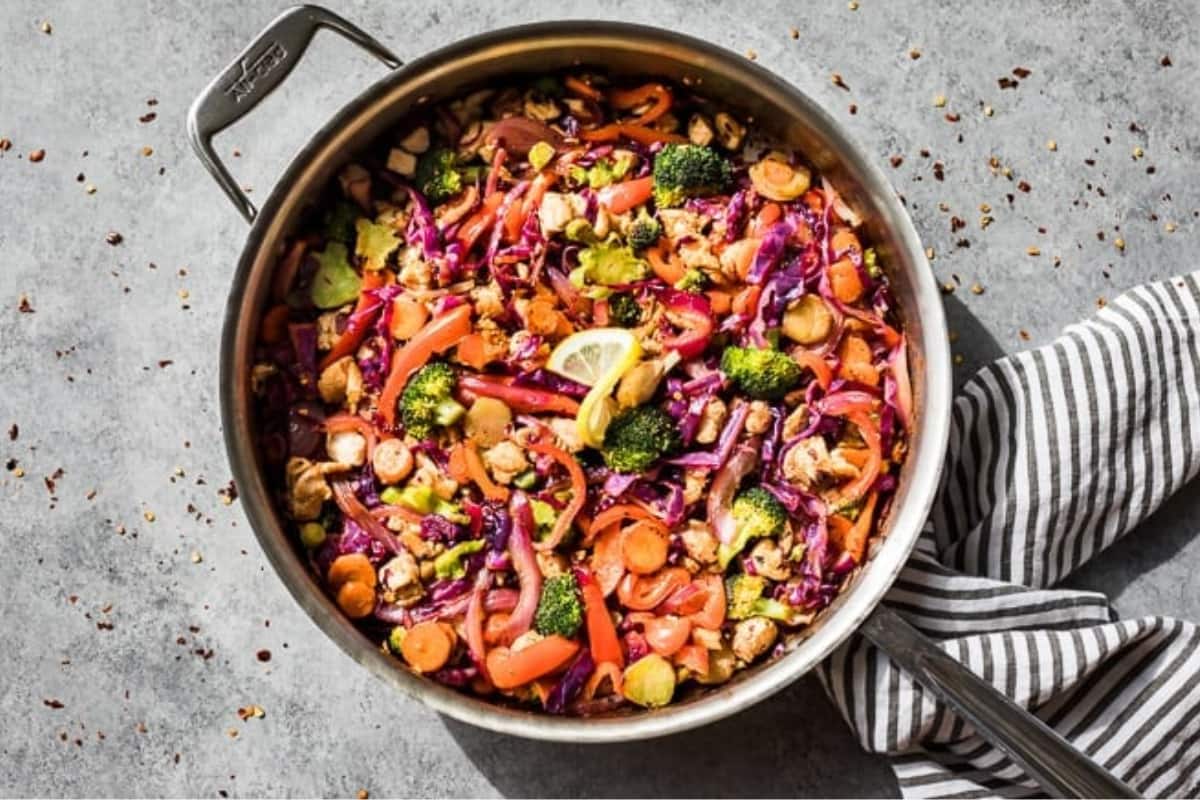 A dish of Whole30 Chicken Stir Fry with 3 Sauces.