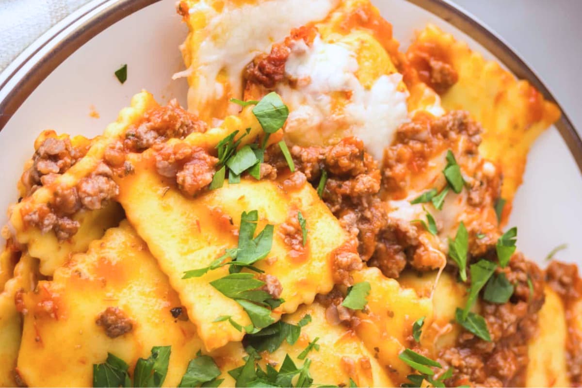 A bowl of Ravioli Casserole with Meat Sauce.