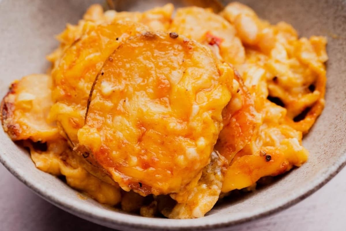 A dish of Cheesy Buffalo White Bean Potato Bake.