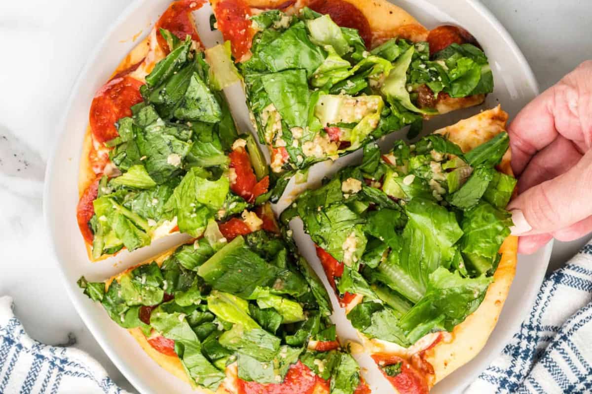 A plate of Caesar Salad Pizza.