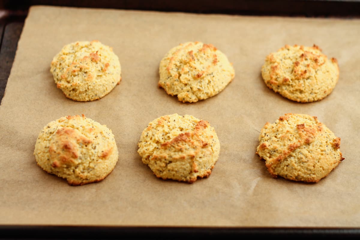 Freshly baked buns on a sheet pan.