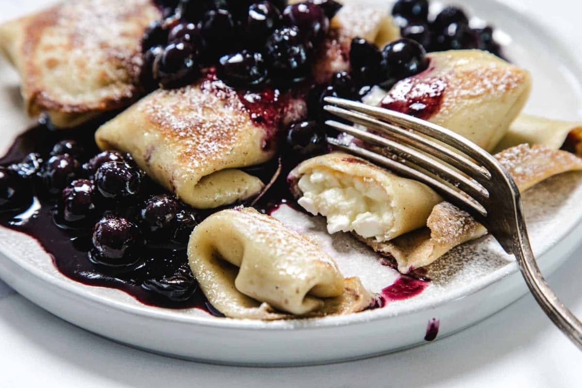 A plate of Cottage Cheese Blintzes.
