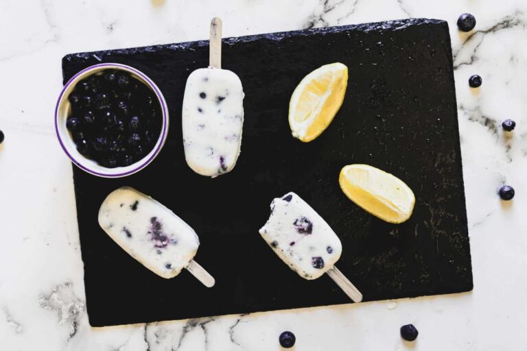 A tray of Blueberry Cottage Cheese Popsicles.