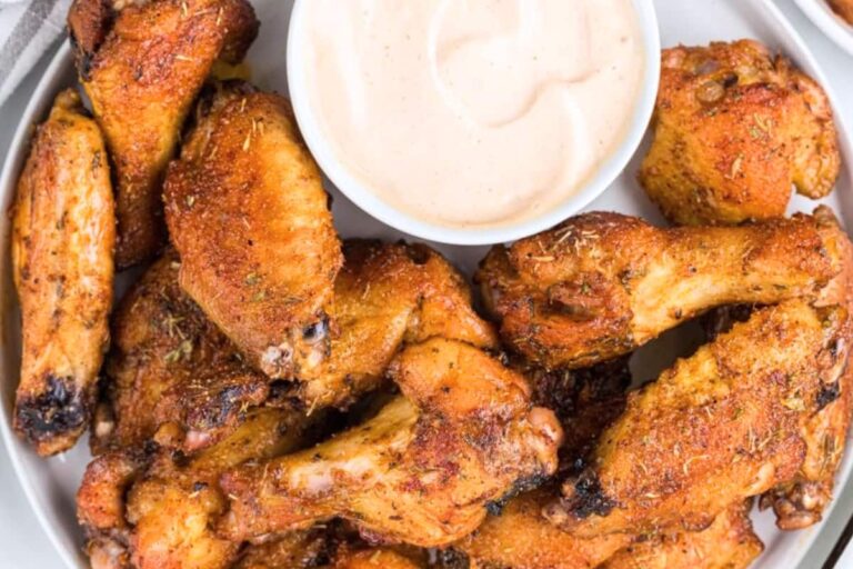 A dish of Cajun Chicken Wings with Remoulade Sauce.