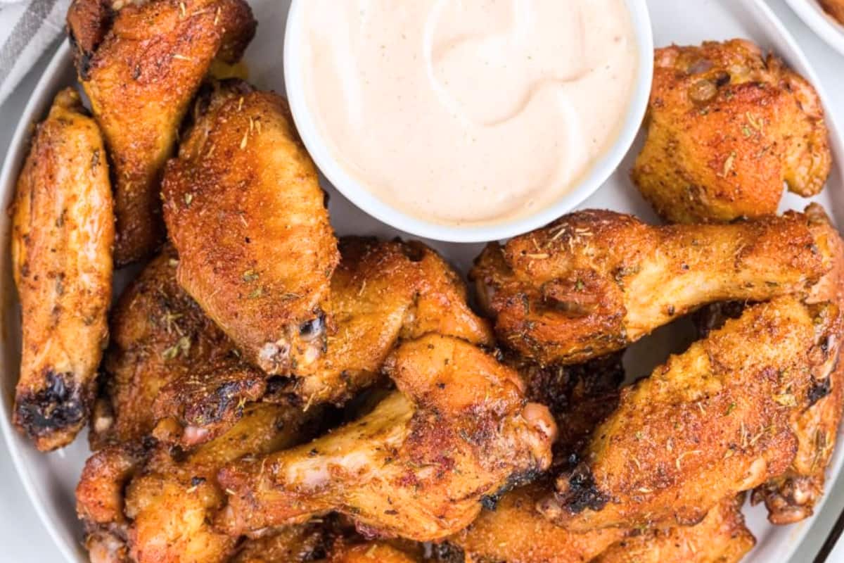 A dish of Cajun Chicken Wings with Remoulade Sauce.