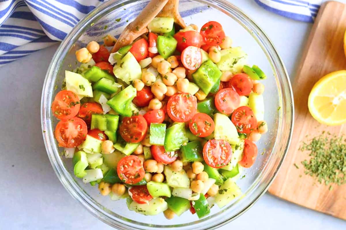 A bowl of Chickpea Tomato Cucumber Salad.