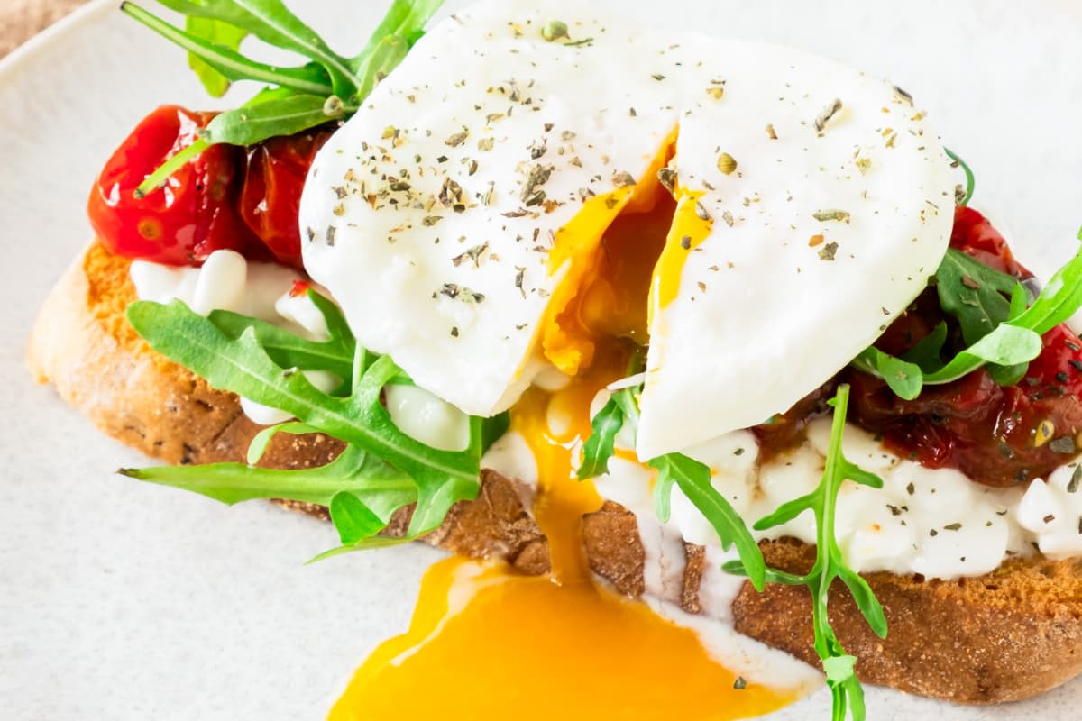 A plate of Cottage Cheese Toast with Poached Egg.