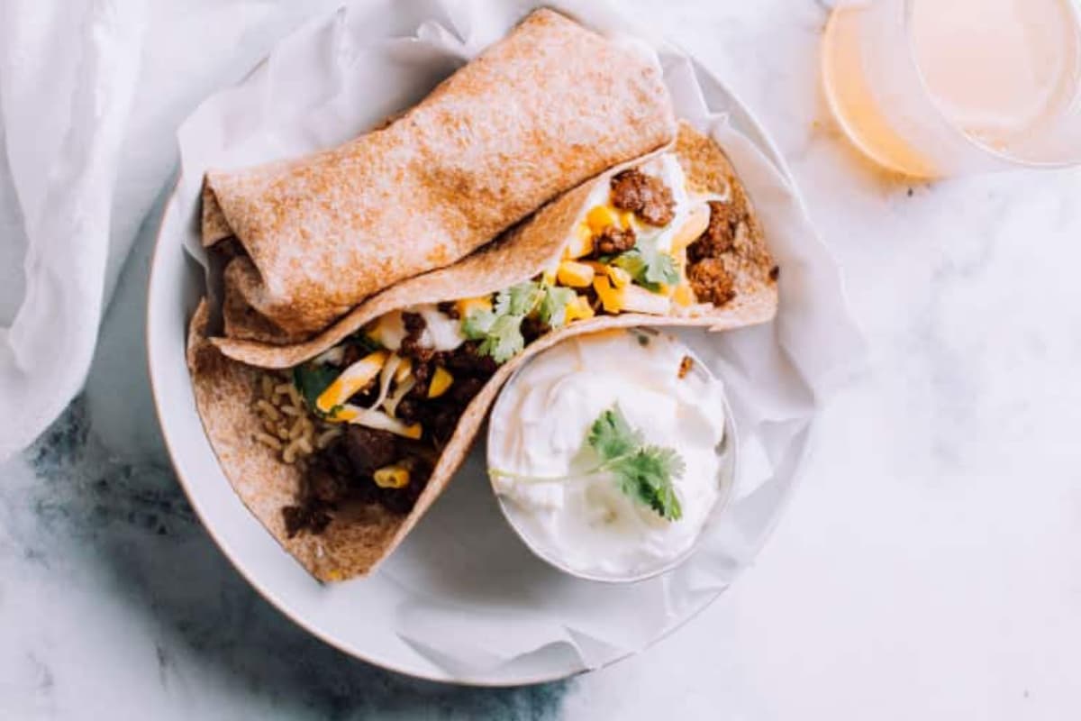 A plate of Ground Beef, Rice & Cheese Freezer Burritos.