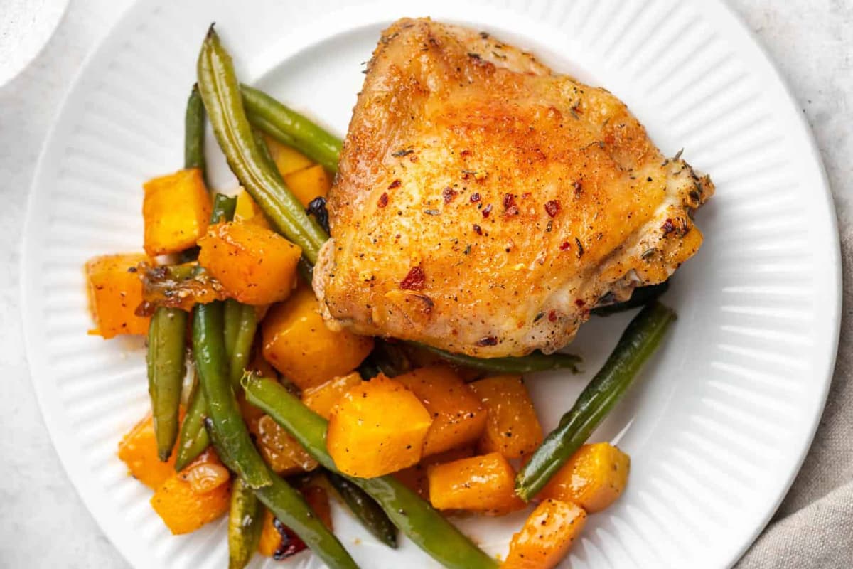 A plate of Sheet Pan Maple Chicken Thighs.