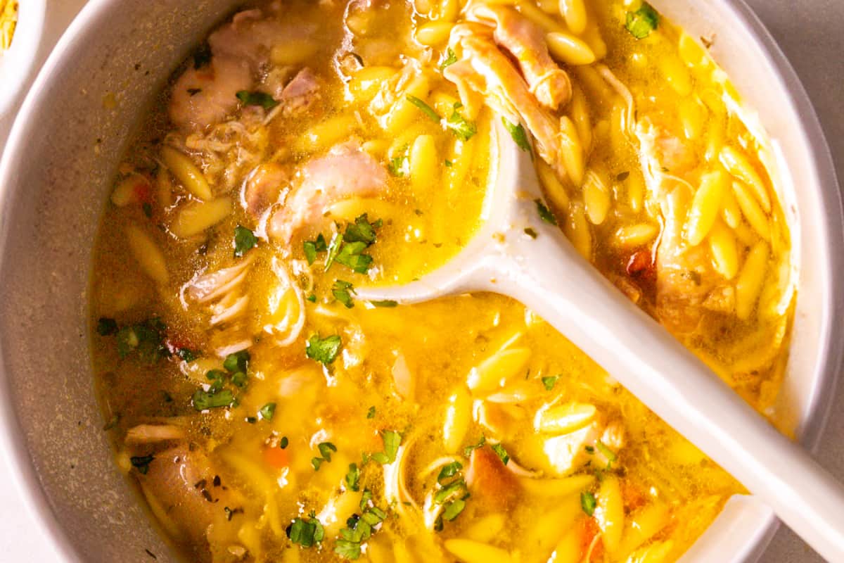 A dish of Lemon Chicken Orzo Soup.