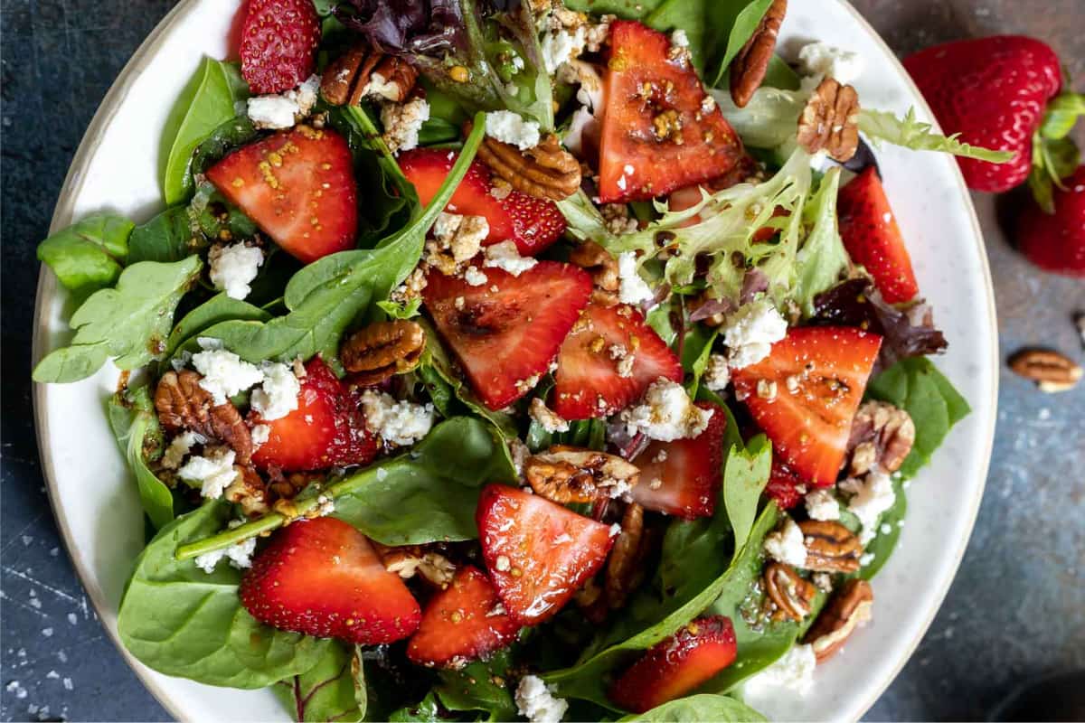 A plate of Maple Balsamic Strawberry Spinach Salad.