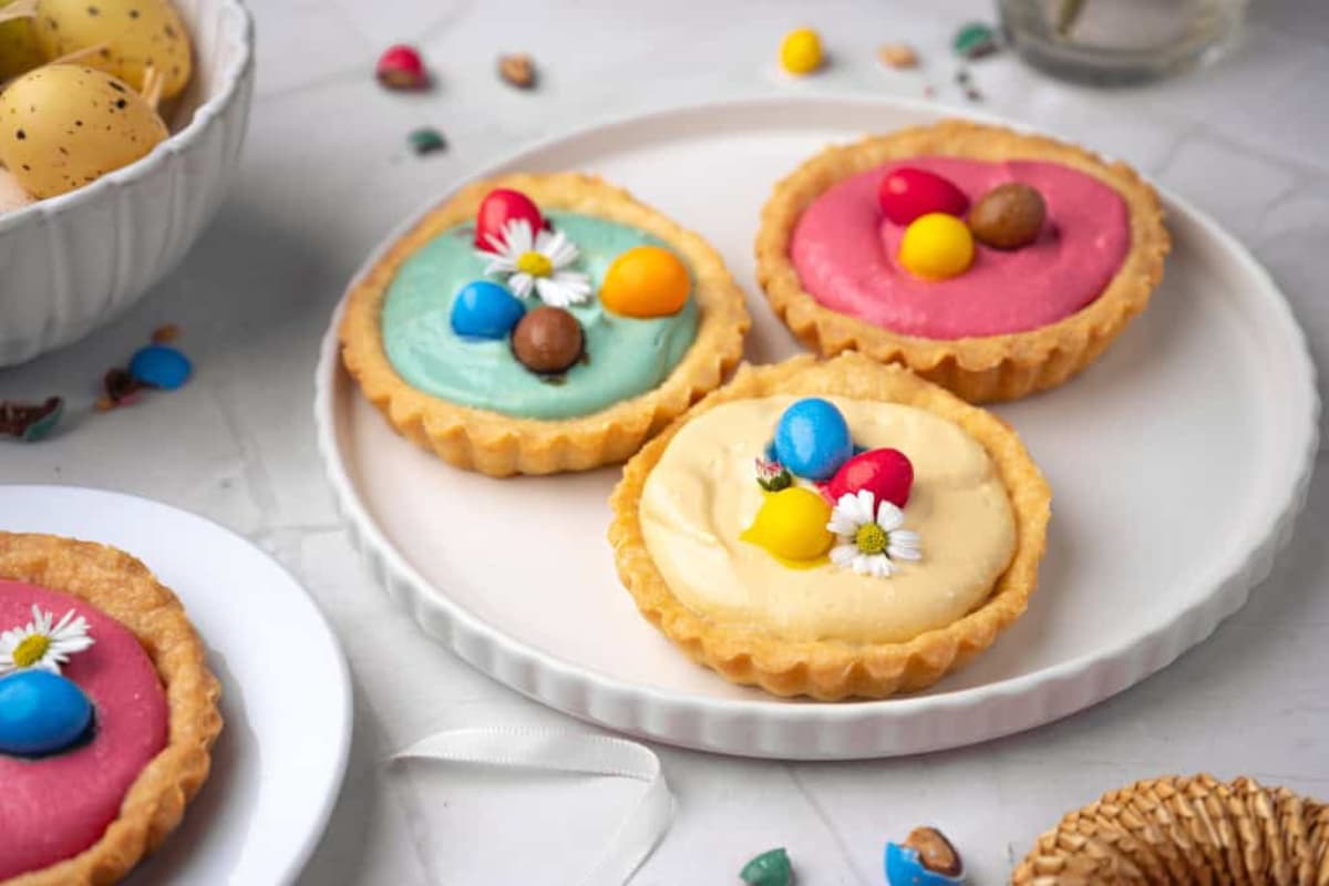 A plate of Mini Spring Cheesecake Tarts.