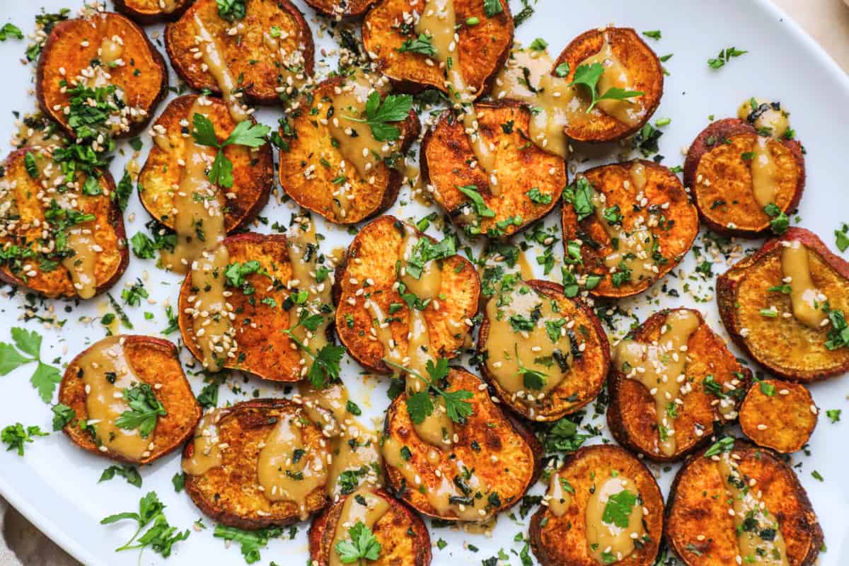 A plate of Japanese Sweet Potatoes with Miso Tahini Dressing.