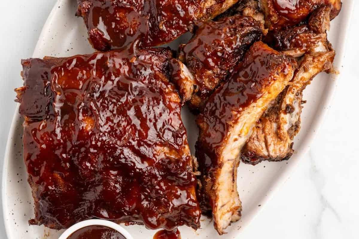 A dish of Slow Cooker BBQ Baby Back Ribs.