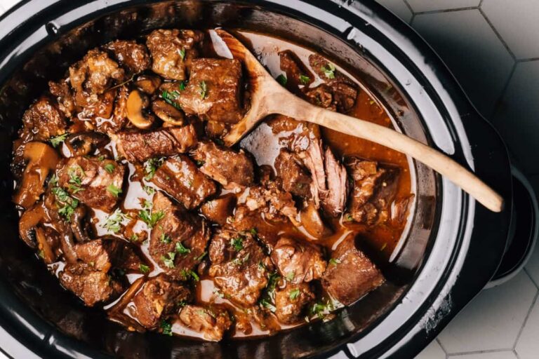 A dish of Tender Crockpot Beef Tips (with Gravy).