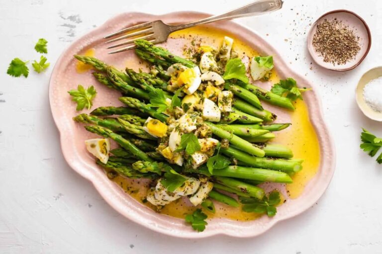 A plate of Asparagus with Gribiche Dressing.