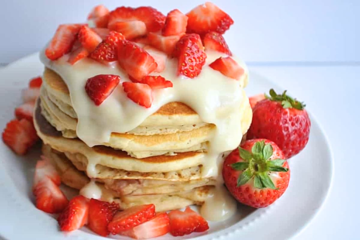 A plate of Strawberries and Cream Pancakes.