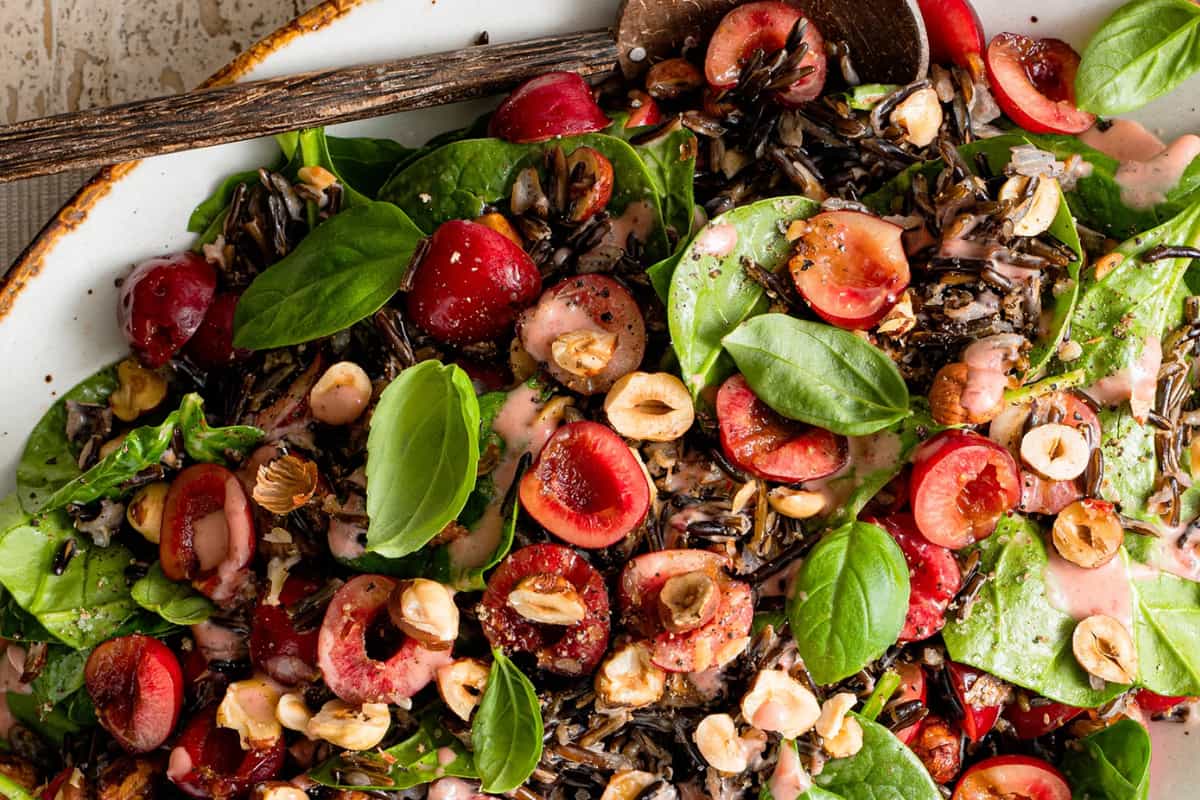 A dish of Wild Rice Salad with Cherries and Hazelnuts.