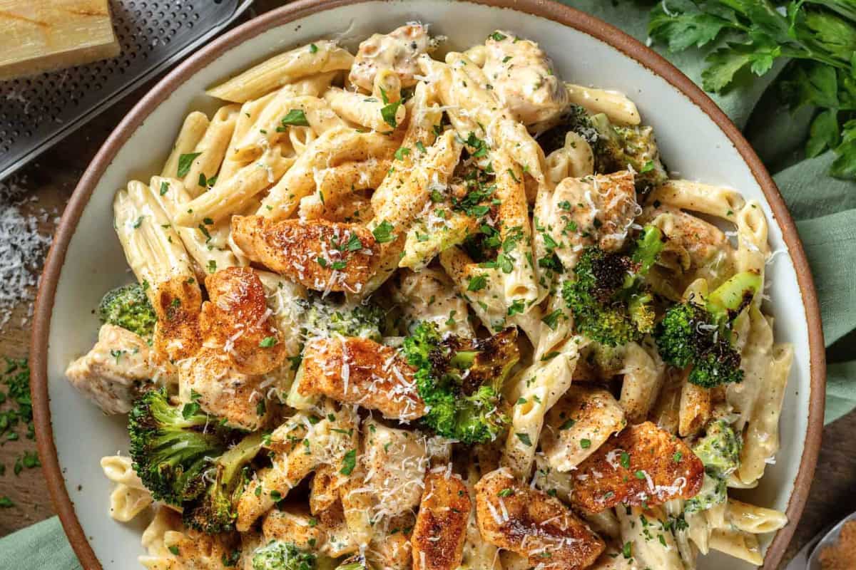 A bowl of One Pot Cajun Chicken and Broccoli Alfredo.