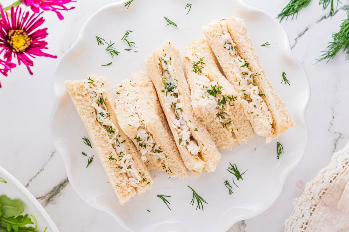 A plate of Chicken Salad Tea Sandwiches.