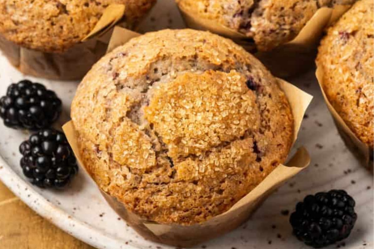 A plate of Gluten Free Blackberry Muffins.