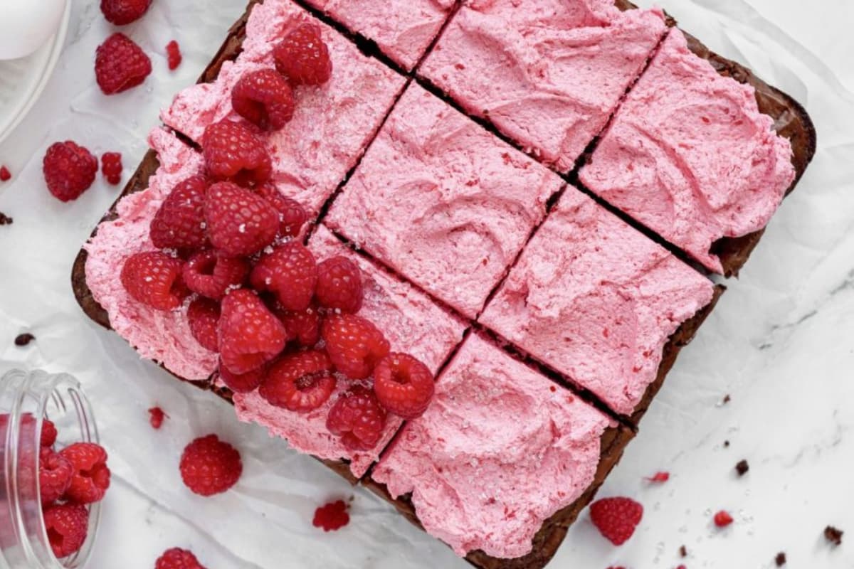 A plate of Raspberry Brownies with Raspberry Frosting.