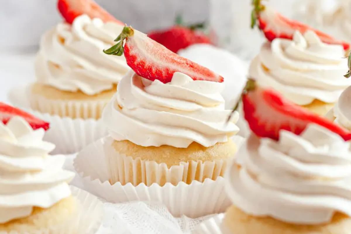 A plate of Strawberry Shortcake Cupcakes.
