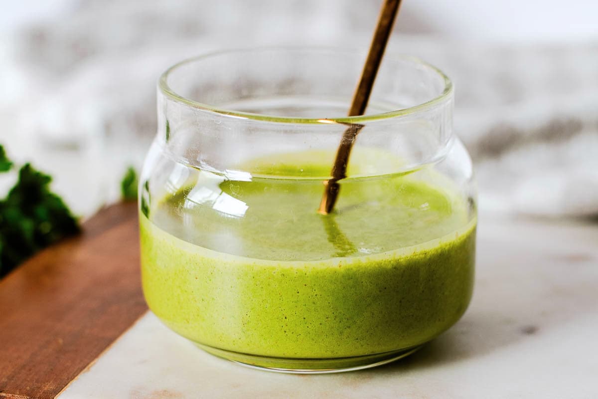 A jar of Dairy Free Green Goddess Salad Dressing.