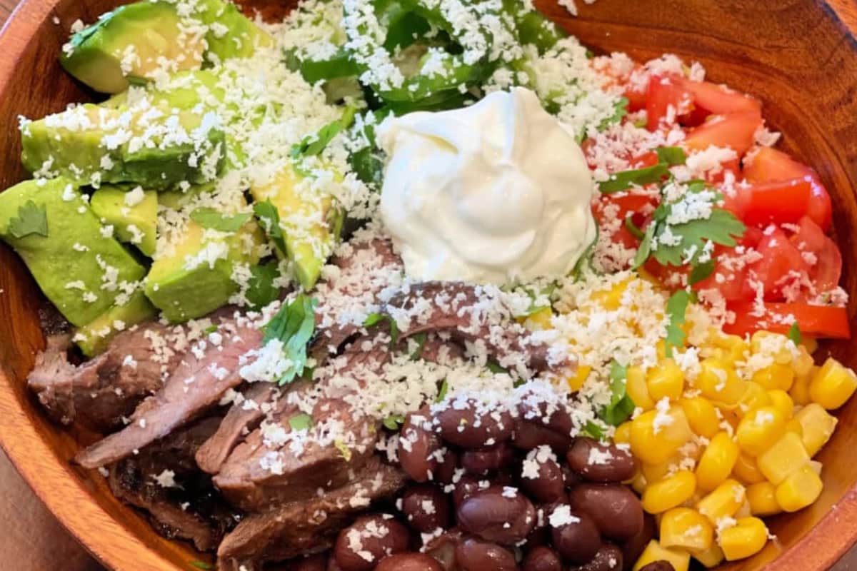 A bowl of Sizzling Steak Burrito Bowl.