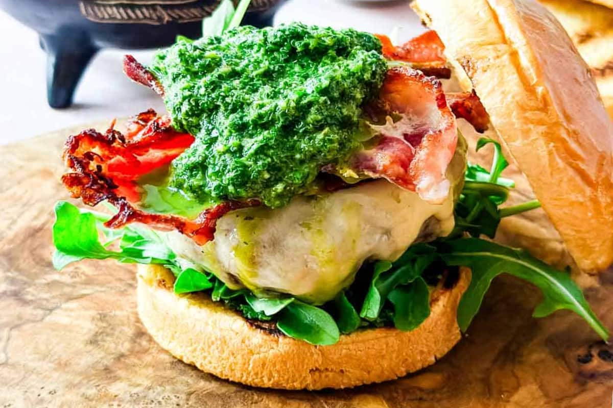 A plate of Grilled Lamb Burger with Mint-Jalapeño Chimichurri.